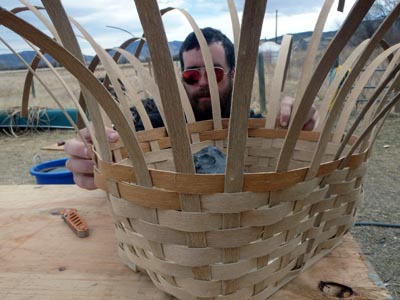 Weaving a pack basket.