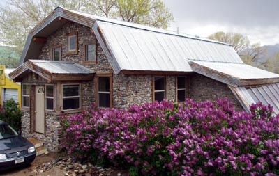 Slipform stone house built by students.