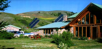 Elpel passive solar stone and log house.